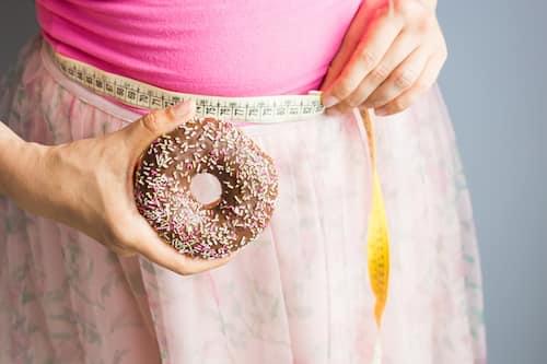woman-holding-donut